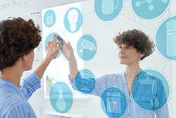 woman using a touchscreen wall mirror