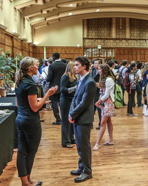 Student speaking with an employer at a career fair