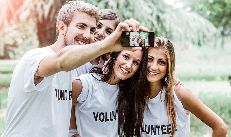 Four volunteers taking a selfie